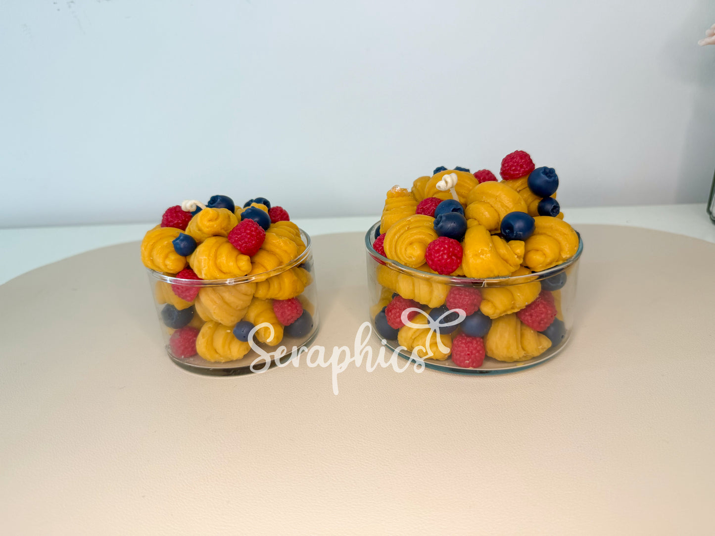 Close-up breakfast croissant candle with berries in glass jar